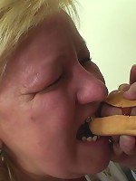 Mature chick makes a hotdog out of his cock and then gets it in her old pussy