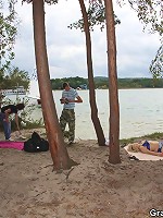 After they spend plenty of time fucking her on the beach the two young men cum on the chick