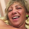 Two dicks fuck this granny slut and then they cum on her tits and make her smile