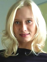 Blonde haired beauty does a strip tease in her apartment..