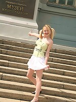 Cute blonde shows off her tiny panties