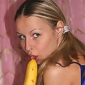 Horny teen plays with banana