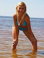 Sweet blonde teen gets naked outdoors