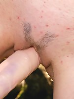 Horny blonde teen plays with dildo outdoors