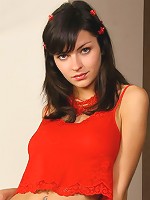 Sexy brunette shows off red stockings