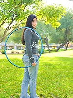 Nadine hula hoops naked outside