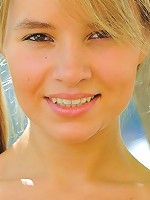 Blonde pigtail teen using four fingers