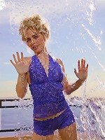 Glamorous model Kara in her skimpy blue nightie teasing at the shoot