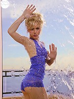 Glamorous model Kara in her skimpy blue nightie teasing at the shoot