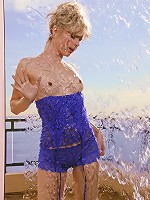 Glamorous model Kara in her skimpy blue nightie teasing at the shoot