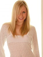 Kara in a fine sexy dress gets naughty and stuffs a dildo into her pussy on the chair