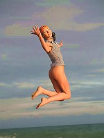 Very skinny and sporty teen jumping and flying naked on the beach