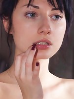 Tatooed shaved brunette teen posing nude in front of the mirror