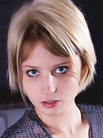 Bewitching and short haired blonde with small mammaries is showing her tits