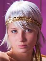 Brave goddess blonde is reading her favorite book on the chair indoors