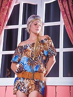 Brave goddess blonde is reading her favorite book on the chair indoors