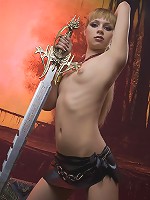 Fiery redhead teen exposes her flesh and steel sword