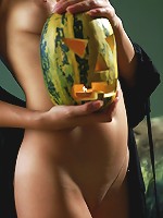 Trick or Treat! Beautiful brunette teen with the pumpkin-head