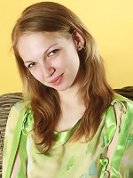 Blonde busty teen Claudia posing without panties and in sheer blouse