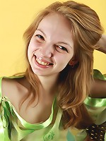 Blonde busty teen Claudia posing without panties and in sheer blouse