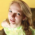Blonde busty teen Claudia posing without panties and in sheer blouse