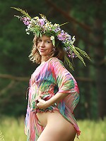 Beautiful small breasted teen posing nude on the meadow