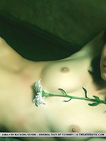 Nubile, fresh, and innocent, Lana shares a generous serving of her erotic assets, starting with her round, delectable breasts, and untrimmed bush.