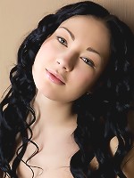 Dark-haired stunner with creamy complexion, pink nipples and untrimmed bush.