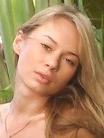 Blonde teen taking down her clothes