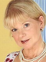 Blonde naughty grandma unveils it all