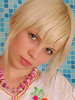 Blonde stripping in a bathroom