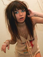 Petite brunette teen Kaira plays in her cute skimpy dress