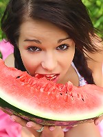 Gorgeous 18 year old cutie eating watermelon outdoors