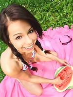 Gorgeous 18 year old cutie eating watermelon outdoors