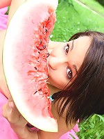 Gorgeous 18 year old cutie eating watermelon outdoors
