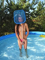 Hot teen Kiki fooling around in her outdoor swimming pool