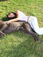 Sexy brunette teen plays with her cane corso