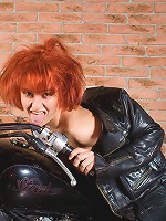 Horny biker Maggie riding her motobike without panties