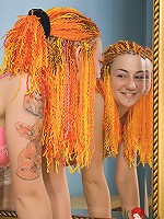 Redhead teen Maggie strips in front of the mirror